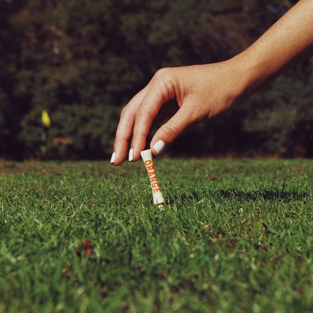 Orange bamboo golf tee