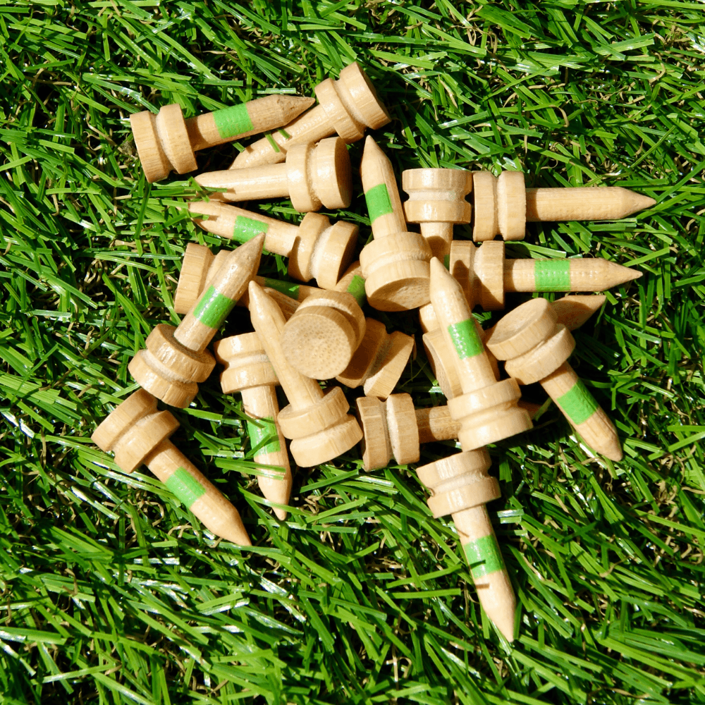 green 25mm Bamboo Castle Golf Tees on astro turf