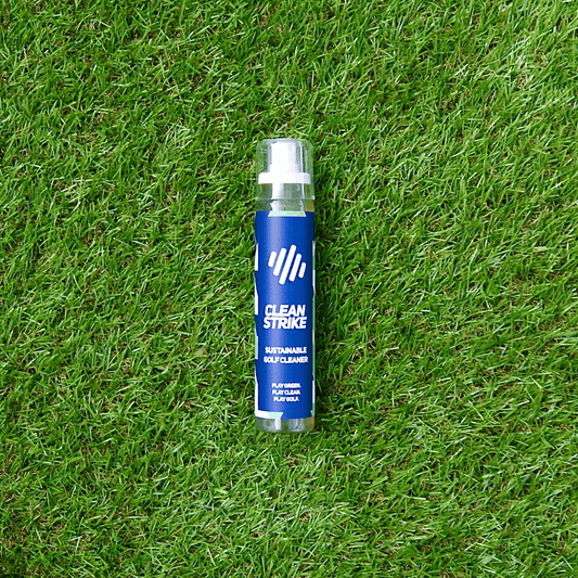clean strike Sustainable Golf Cleaner spray bottle laying on astro turf