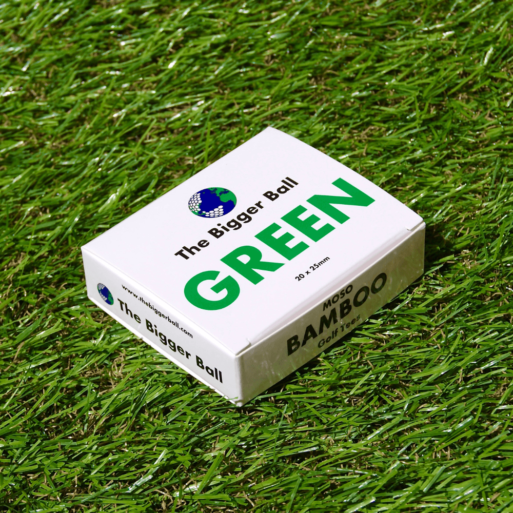 box of green 25mm Bamboo Castle Golf Tees on astro turf