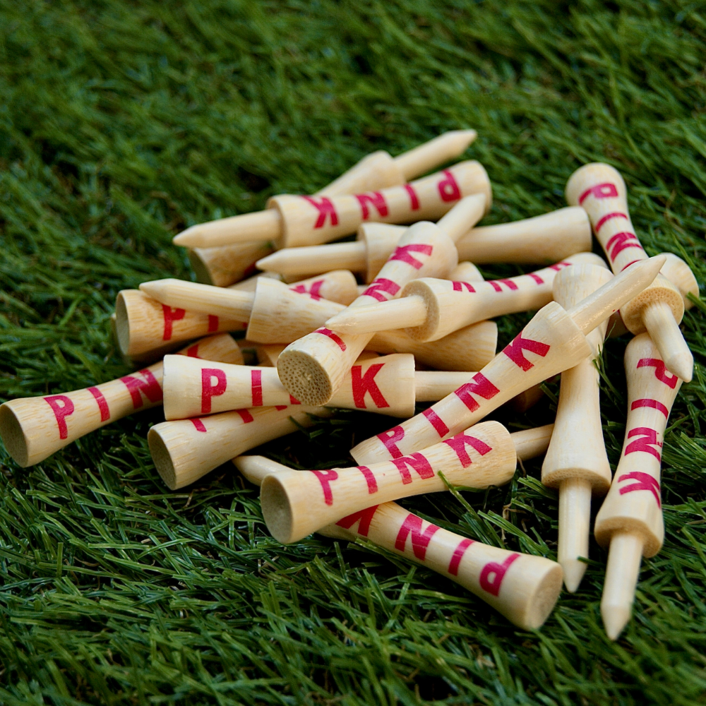 loose Pink golf tees on astro turf