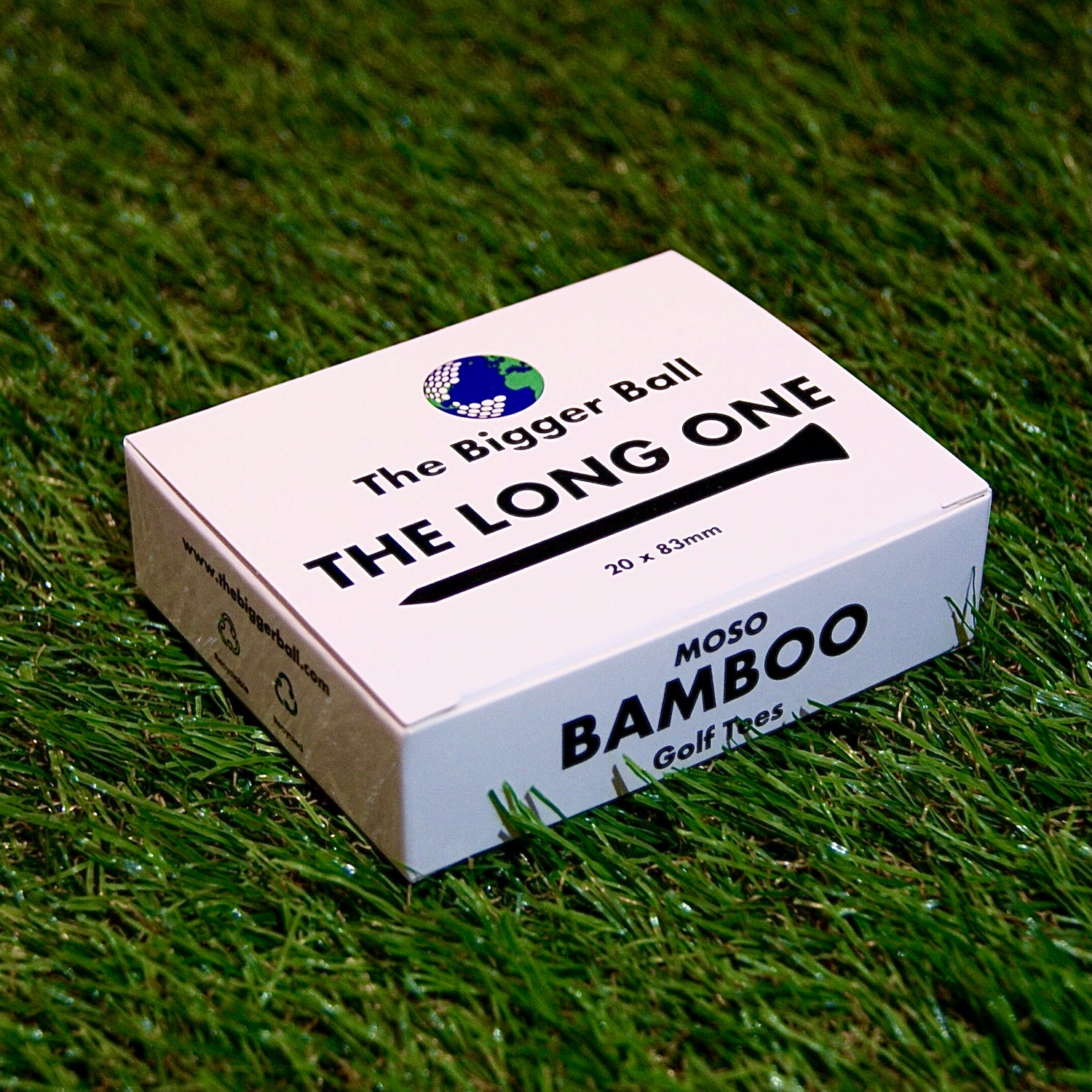 box of Long Golf Tees on grass